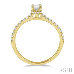 1/2 Ctw Round Cut Diamond Engagement Ring With 1/4 Ct Oval Cut Center Stone in 14K Yellow Gold