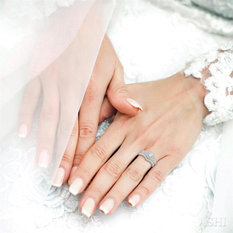 7/8 Ctw Diamond Wedding Set with 3/4 Ctw Round Cut Engagement Ring and 1/5 Ctw Wedding Band in 14K White Gold