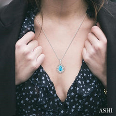 9x6 MM Pear Shape Blue Topaz and 1/10 Ctw Round Cut Diamond Semi-Precious Pendant With Chain in 10K White Gold