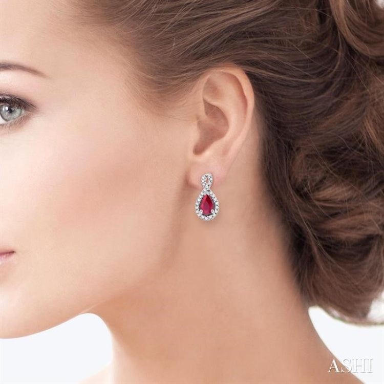 5x3 MM Pear Shape Ruby and 1/6 Ctw Round Cut Diamond Earrings in 14K White Gold