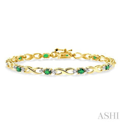 4x3 MM Oval Cut Emerald and 1/10 Ctw Round Cut Diamond Bracelet in 10K Yellow Gold