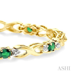 4x3 MM Oval Cut Emerald and 1/10 Ctw Round Cut Diamond Bracelet in 10K Yellow Gold