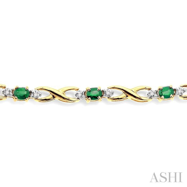 4x3 MM Oval Cut Emerald and 1/10 Ctw Round Cut Diamond Bracelet in 10K Yellow Gold