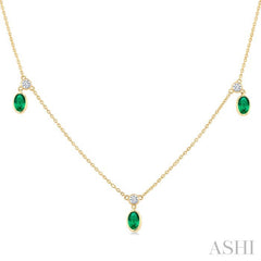 5x3 MM Oval Shape Emerald and 1/8 Ctw Round Cut Diamonds Precious Station Necklace in 10K Yellow Gold