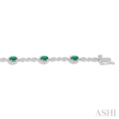 5x3 MM Oval Cut Emerald and 1/20 Ctw Round Cut Diamond Bracelet in 10K White Gold