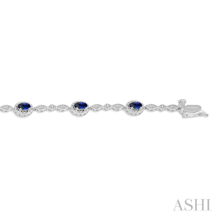 5x3 MM Oval Cut Sapphire and 1/20 Ctw Round Cut Diamond Bracelet in 10K White Gold